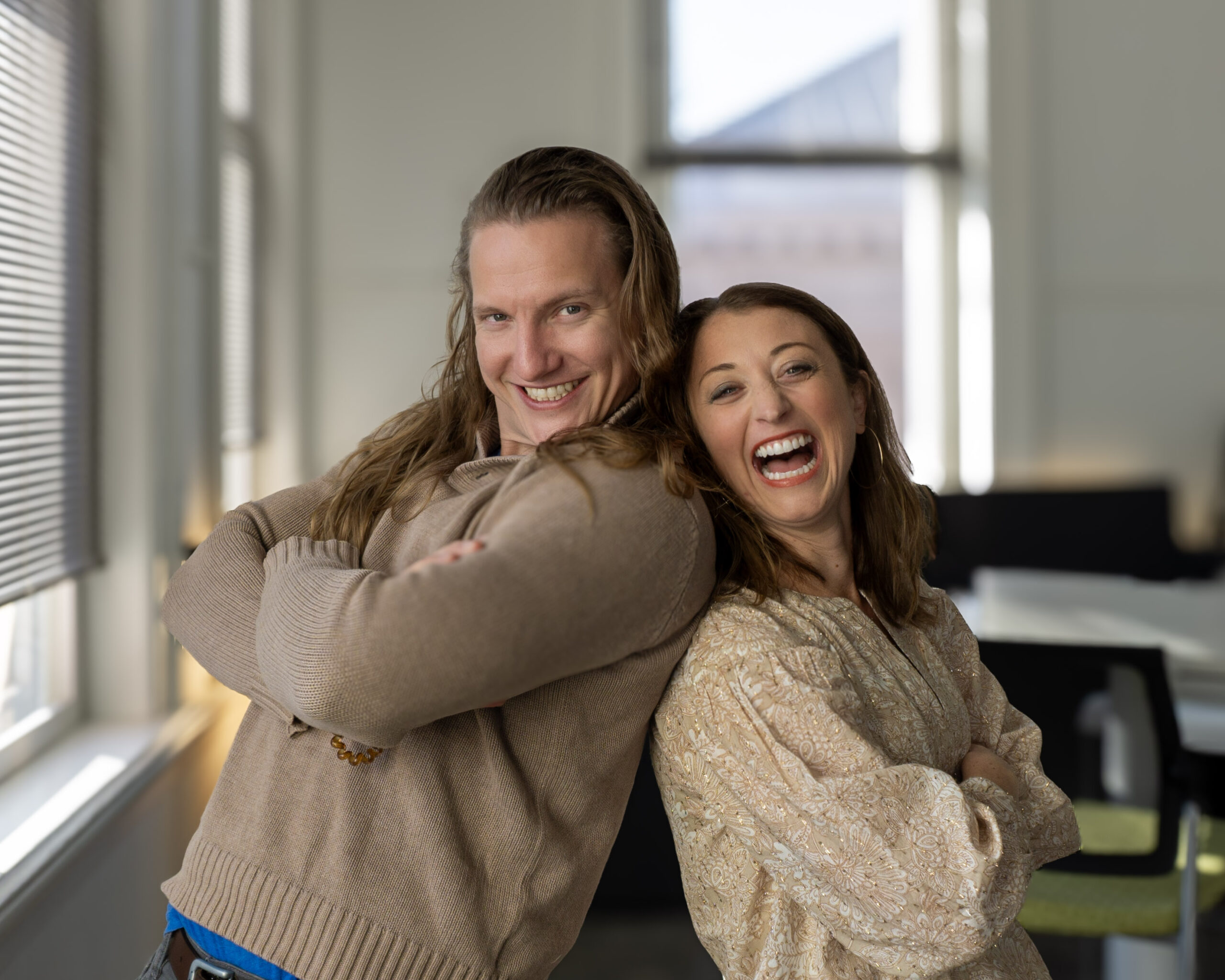 Team members smiling in the office